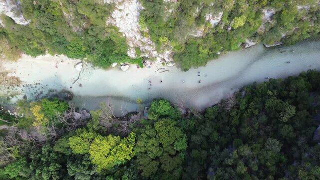 Drone rises to reveal a wider view of Acheron River gorge and forest in Greece