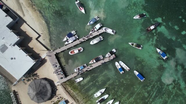 Aerial Top Down View of Gran Roque Pier with Boats and Tourist