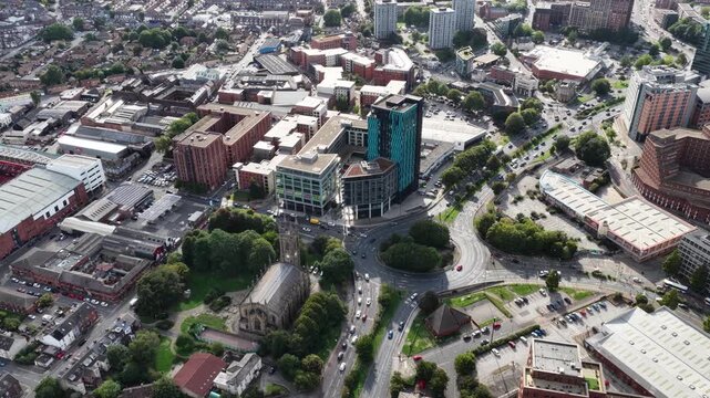 Wide aerial drone footage of Sheffield city centre, England, showing the Bramall Lane area and Sheldon Street. The drone slowly moves backwards in a smooth wide pan