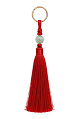 Vibrant red tassel keychain with a light green jade bead and golden ring, photographed on a clean white background © no one