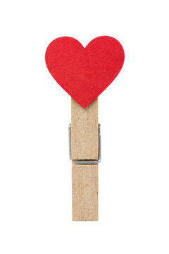Small red heart-shaped paper is held firmly by a wooden clothespin, isolated on a clean white background