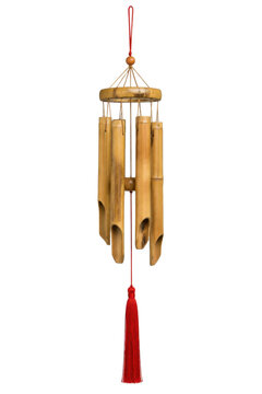 Traditional bamboo wind chimes with a vibrant red tassel hanging gracefully against a clean white background, creating a serene and decorative object