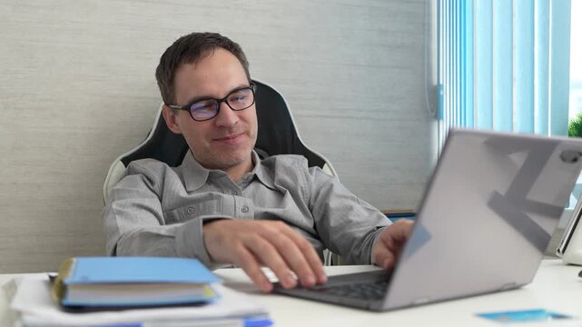 Joyful businessman pleased with partner's position during video call deal and online negotiation success.
