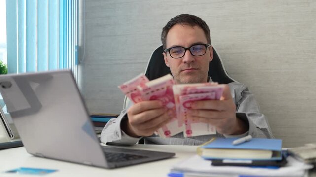 Banking and currency management. Financial services. Business solution. Businessman working in exchange office. Man making notes at money counter. Economic wealth and value investing