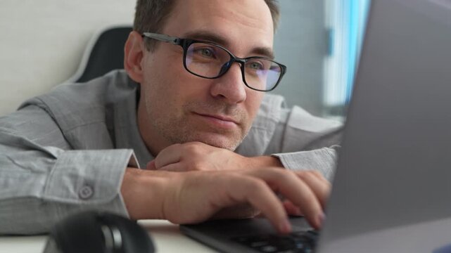 Laptop, thinking and business man in office, working on project or email. Computer, professional and male person problem solving, looking for solution or planning, reading or focus on decision making