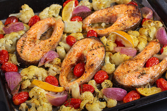 Healthy Salmon Dinner with Roasted Cauliflower and Cherry Tomatoes. Overhead