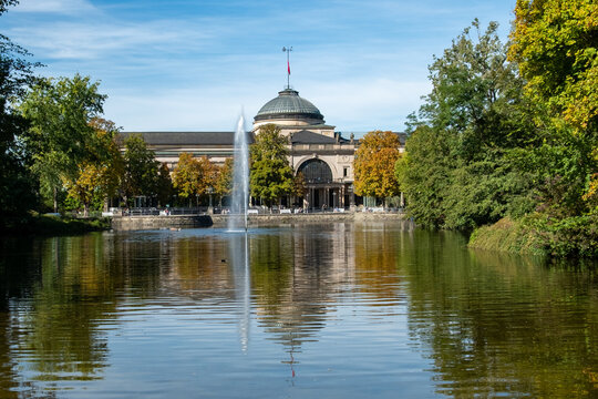 grand neoclassical Kurhaus Wiesbaden viewed across the scenic pond in the adjacent Kurpark