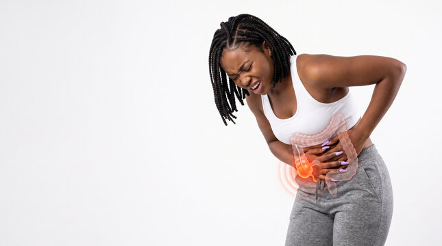 Woman with abdominal pain and glowing intestine overlay, copy space