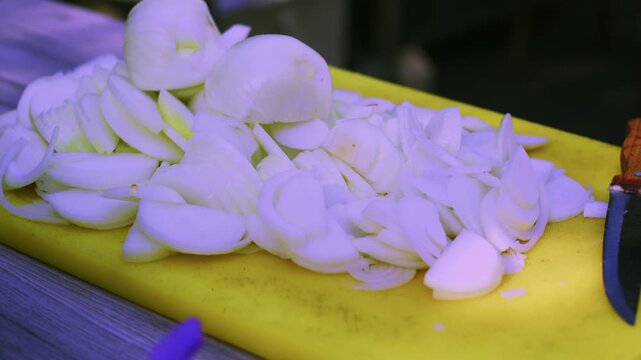 Close-up of large pieces of boiled meat for pilaf in aluminum bowl