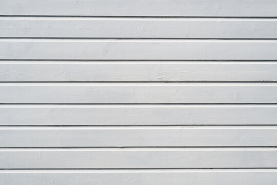 White painted horizontal wooden boards with subtle wood grain