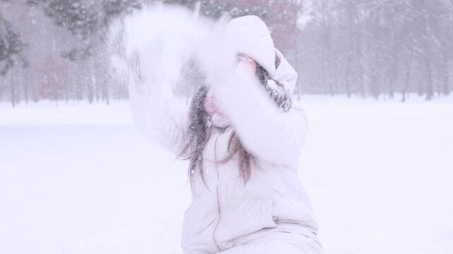 Child winter snow. Toddler playing together with mother outdoors. Happy family concept.