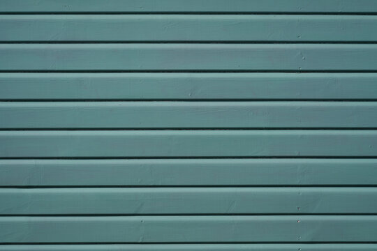 Teal painted wood texture with horizontal wooden boards
