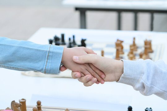 Handshake Between Chess Players