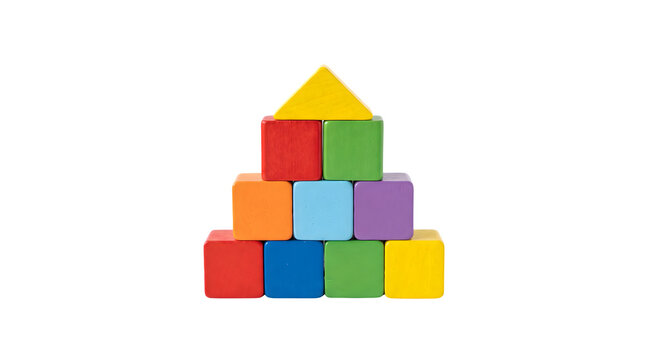 Colorful wooden toy blocks built into house shape, stack of bright primary color building cubes, early childhood development concept on white background