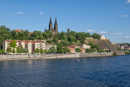 The Vltava river flows past the historic Vysehrad hill in Prague