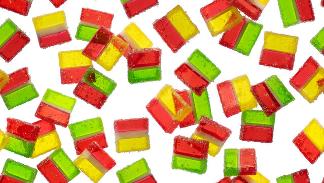 Vibrant background banner of scattered three layered jelly marmalade candies isolated on transparent background. Neon gummy sweets layout