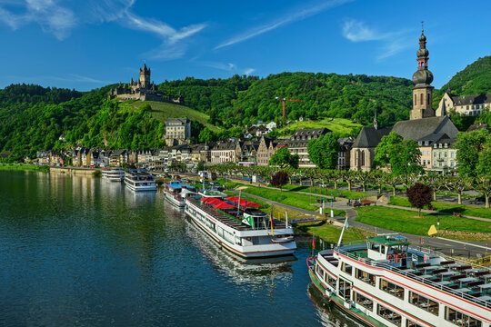 A cruise ship floats on the river Mosel in Cochem Germany