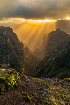 Sunset sunbeams over Pico do Areeiro hiking trail in Madeira