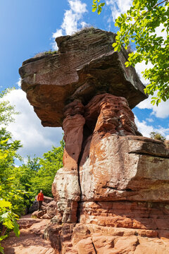 Senior man visits the Devils Table rock formation in Germany