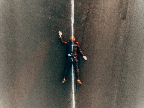 Run over man lying on road