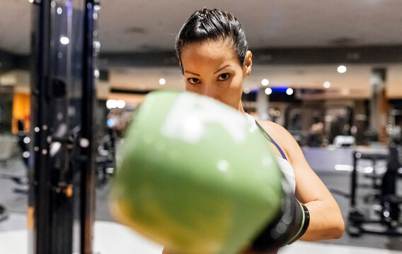 Woman practicing boxing in the gym