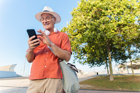 Tourist uses smartphone for directions at Parc del F�rum in Spain