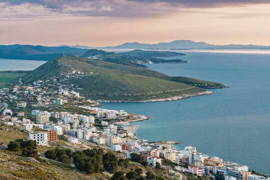 The coastal town of Saranda borders the Adriatic sea at sunset