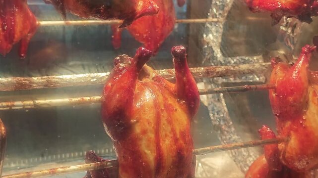 Rotisserie chicken in an oven