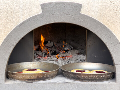 Fire burns inside stone oven