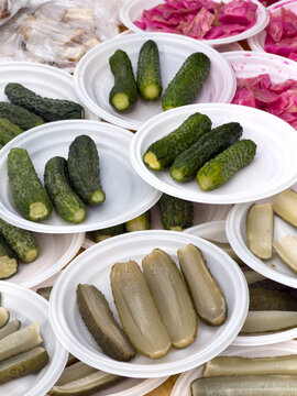 Fresh cucumbers arranged on white plates