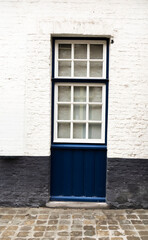 Fototapeta premium Ancient stone Bonifacius Bridge and historic brick house over canal in Bruges, Belgium