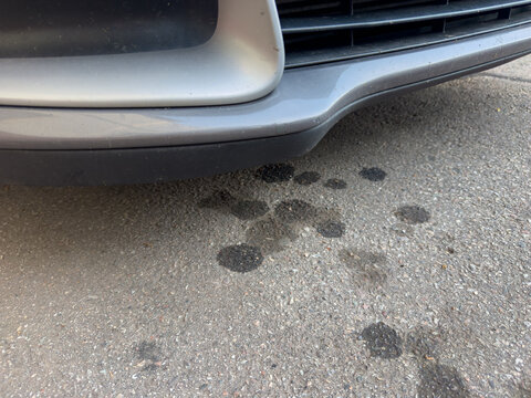 Oil Stains Under Car Symbolizing Environmental Pollution
