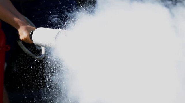 Outdoor Carbon Dioxide Fire Extinguisher Use Close Up Slow Motion