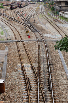a railway track layout featuring multiple parallel tracks, switches, and a turnout with points where lines diverge and merge on a gravel ballast bed.