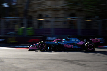 Naklejka premium BAKU, AZERBAIJAN - SEPTEMBER 2026: Pierre Gasly drives the BWT Alpine F1 car at high speed along the Baku City Circuit during Formula 1 Azerbaijan Grand Prix 2026