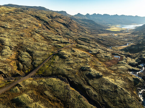 Aerial view of the scenery over a mountain range - Iceland