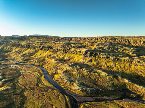 Aerial view of the scenery over a mountain range - Iceland