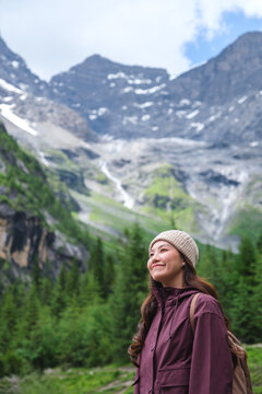 Vertical portrait image of a woman with mountain range in summertime, Chengdu, China
