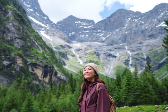 Portrait image of a woman with mountain range in summertime, Chengdu, China