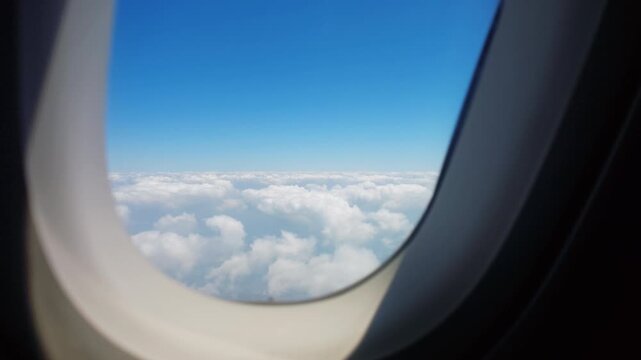 Clouds viewed through passenger airplane window