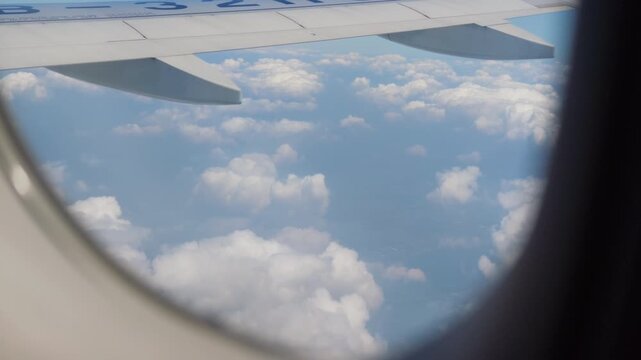 Aerial landscape viewed through airplane window
