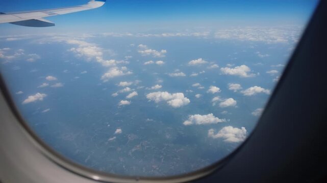 Aerial view of cloudscape from passenger airplane window