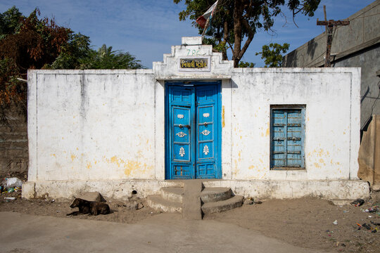Blue door of a whitewashed house, Mandvi, India