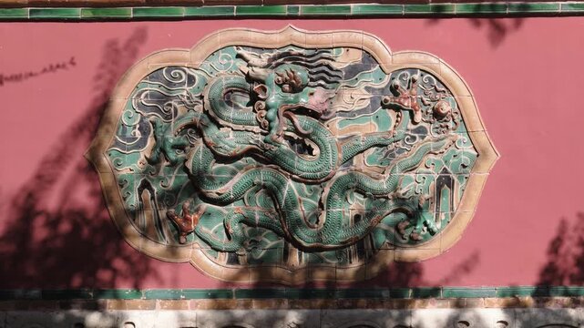 Close-up of dragon relief on red wall at Zhaoling Tomb