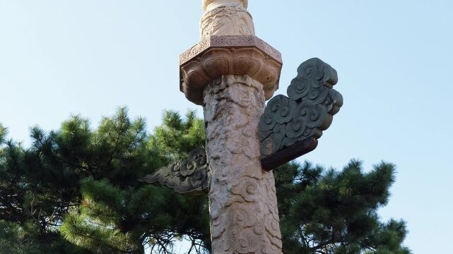 Ornamental huabiao stone column against blue sky at Zhaoling Tomb