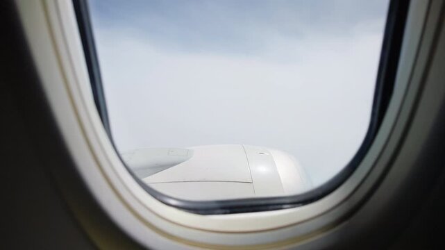 Aerial landscape viewed through airplane window