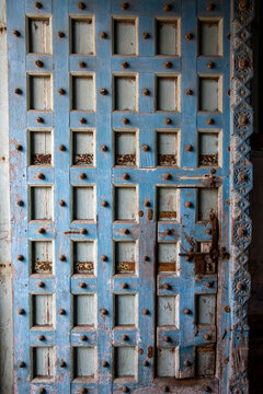 Close-up of a weathered blue wooden door, Mandvi, India