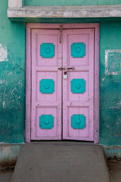 Pink and turquoise wooden door, Mandvi, India