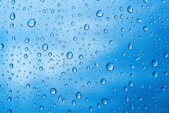 Water backgrounds with water drops. Blue water bubbles on window glass.