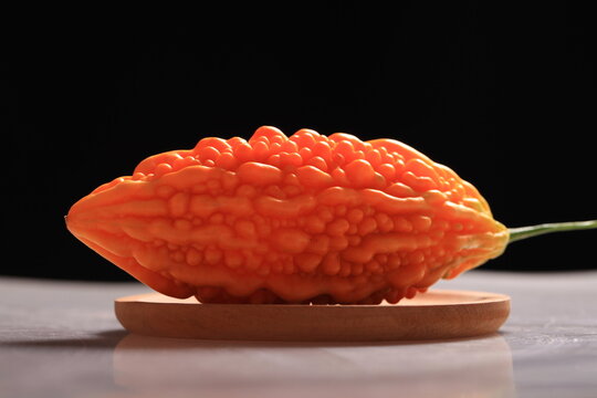 Fresh bitter gourd, black background